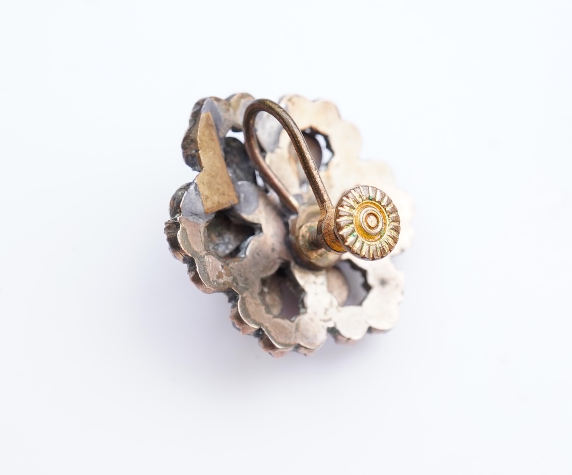 A suite of garnet and paste jewellery, comprising: a brooch, 5cm diameter; a bangle, inner circumference 16cm; two rings, sizes I and M; a pair of earrings, and a single earring, each set with rose-cut garnets; and a pai